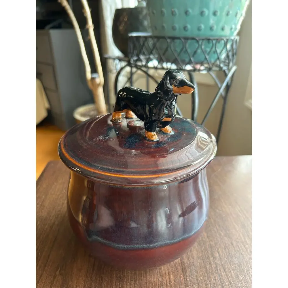 Mudipaws Pottery ceramic treat jar topped w/ a dachshund by artist Debi Manduca